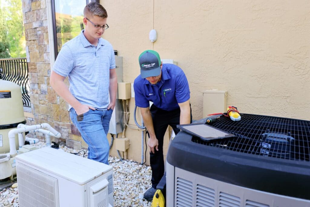 A technician talking to a property owner.