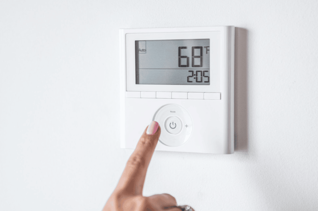 adjusting thermostat settings